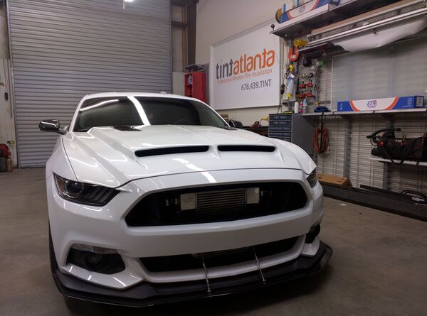 Ford Mustang GT front view showing professional dark window tint by Tint Las Vegas