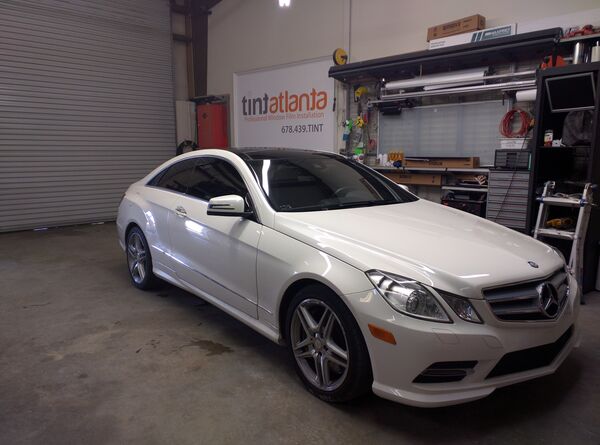 White Mercedes-Benz E-Class Coupe with professional window tinting Las Vegas
