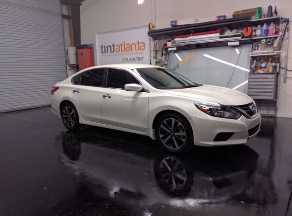 White Nissan Altima sedan with window tint installation Tint Las Vegas