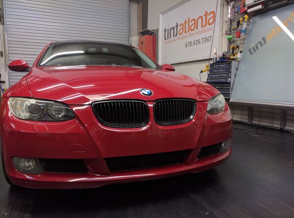 Red BMW Coupe front view with dark window tint by Tint Las Vegas